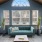 Spacious and well lit waiting room with large windows and a large couch