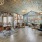 Spacious and well lit leasing office with wood floors and a large window.	